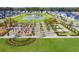 Aerial shot of the neighborhood, highlighting the community park and a small lake at 120 Moscato Ln, Summerville, SC 29485