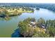 Beautiful aerial shot of a waterfront property surrounded by mature trees and lush landscaping at 120 Moscato Ln, Summerville, SC 29485