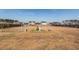 Spacious fenced backyard featuring a center fountain surrounded by benches at 121 Lakelyn Rd, Moncks Corner, SC 29461