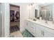Bright bathroom with double sinks, white cabinets, and a walk-in closet connected at 121 Lakelyn Rd, Moncks Corner, SC 29461