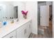 Bathroom with white cabinets, modern fixtures and wood-look flooring at 121 Lakelyn Rd, Moncks Corner, SC 29461