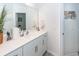 Bathroom with a large mirror, white cabinets, and hard surface countertops at 121 Lakelyn Rd, Moncks Corner, SC 29461