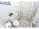Bathroom with a white toilet, shower with decorative curtain and a small plant at 121 Lakelyn Rd, Moncks Corner, SC 29461