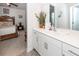 Bathroom sink with white cabinets, hard surface countertop, and views of the bedroom at 121 Lakelyn Rd, Moncks Corner, SC 29461