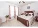 Comfortable bedroom with a wooden bed frame, soft carpet, and natural lighting at 121 Lakelyn Rd, Moncks Corner, SC 29461