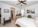 Bedroom with a white dresser, ceiling fan, and views of the Primary bath at 121 Lakelyn Rd, Moncks Corner, SC 29461