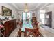 Dining area with chandelier lighting, dining table, and view to the entry at 121 Lakelyn Rd, Moncks Corner, SC 29461