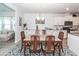 Dining room with modern table, seating for six, and views of the living area at 121 Lakelyn Rd, Moncks Corner, SC 29461