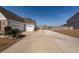 Long driveway leading to a spacious two-car garage, and a landscaped yard at 121 Lakelyn Rd, Moncks Corner, SC 29461