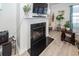 Modern fireplace with black marble hearth and a mounted TV above at 121 Lakelyn Rd, Moncks Corner, SC 29461