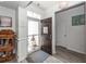 Inviting entryway featuring hardwood floors, decorative accents, and a view to the front door at 121 Lakelyn Rd, Moncks Corner, SC 29461