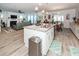 Open concept kitchen with stainless appliances and view of the living and dining areas at 121 Lakelyn Rd, Moncks Corner, SC 29461