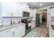 Modern kitchen features stainless steel appliances and light gray cabinets at 121 Lakelyn Rd, Moncks Corner, SC 29461