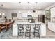 Kitchen with an island with seating, stainless appliances, and adjacent dining area at 121 Lakelyn Rd, Moncks Corner, SC 29461