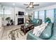 Cozy living room showcasing a fireplace, comfortable seating, and natural light at 121 Lakelyn Rd, Moncks Corner, SC 29461