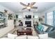 Inviting living room featuring a fireplace, ceiling fan and comfortable seating at 121 Lakelyn Rd, Moncks Corner, SC 29461