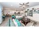 Open-concept living room flows into a kitchen with stainless steel appliances and bar seating at 121 Lakelyn Rd, Moncks Corner, SC 29461