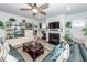Inviting living room features a fireplace, TV, ceiling fan, and comfortable seating at 121 Lakelyn Rd, Moncks Corner, SC 29461