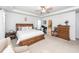 Large primary bedroom featuring a ceiling fan, a desk and chair in the corner, and access to the bathroom at 121 Lakelyn Rd, Moncks Corner, SC 29461