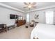 Comfortable primary bedroom with a TV, dresser, ceiling fan, and natural light from the windows at 121 Lakelyn Rd, Moncks Corner, SC 29461