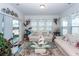 Cozy sunroom with sliding glass door and comfortable seating, great for relaxation at 121 Lakelyn Rd, Moncks Corner, SC 29461
