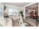 Bright sunroom connects to dining and kitchen areas with decorative touches and ample light at 121 Lakelyn Rd, Moncks Corner, SC 29461
