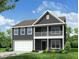 Beautiful two-story home with a covered porch, a two car garage, and professionally landscaped yard at 121 Palfrey Dr, Ridgeville, SC 29472