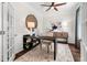 Cozy home office with hardwood floors, decorative rug, modern furnishings, and ample sunlight at 121 Palfrey Dr, Ridgeville, SC 29472