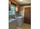 Functional laundry room featuring a window, a door and a washer and dryer at 125 Three Wood Ln, Summerville, SC 29483