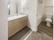 Well-lit bathroom featuring wood vanity and a shower and tub at 1300 Park West Blvd # 420, Mount Pleasant, SC 29466