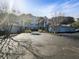 View of the apartment building exterior, showcasing ample parking, landscaping, and accessible parking spaces at 1300 Park West Blvd # 420, Mount Pleasant, SC 29466