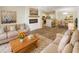 Inviting living room featuring modern décor, an electric fireplace, and an open floor plan into the dining and kitchen areas at 1300 Park West Blvd # 420, Mount Pleasant, SC 29466
