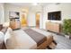 Comfortable main bedroom featuring hardwood floors, ceiling fan, and en-suite bathroom at 1300 Park West Blvd # 420, Mount Pleasant, SC 29466