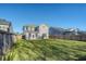 Expansive backyard with healthy green grass and a full privacy fence for safe outdoor enjoyment at 1305 Discovery Dr, Ladson, SC 29456
