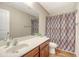 Bathroom featuring vanity with sink, decorative mirror and shower with curtain at 1305 Discovery Dr, Ladson, SC 29456