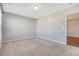Neutral carpeted bedroom with natural light and an open door to closet at 1305 Discovery Dr, Ladson, SC 29456