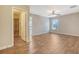Bright bedroom features wood-look floors, a ceiling fan, and an attached bathroom at 1305 Discovery Dr, Ladson, SC 29456