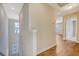 Bright hallway with wood floors leading to various rooms, showcasing the home's layout at 1305 Discovery Dr, Ladson, SC 29456