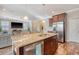Kitchen island featuring a double sink, seating, and stainless steel appliances at 1305 Discovery Dr, Ladson, SC 29456