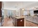Kitchen island and breakfast nook overlooking the living room at 1305 Discovery Dr, Ladson, SC 29456