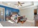 Spacious main bedroom boasting a tray ceiling, accent wall, and stylish furnishings at 1305 Discovery Dr, Ladson, SC 29456