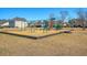 Community playground with swings, slide and climbing area set in a grassy green space at 1305 Discovery Dr, Ladson, SC 29456
