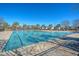 Community pool with sparkling water, palm trees, and plenty of sunshine at 1305 Discovery Dr, Ladson, SC 29456