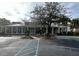 Clubhouse featuring mature trees, lush landscaping, and a convenient parking area at 1310 Basildon Rd # 1310, Mount Pleasant, SC 29466