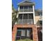 Multi-level screened porch on a brick and beige siding condo building at 1310 Basildon Rd # 1310, Mount Pleasant, SC 29466