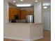 Well-equipped kitchen featuring wood cabinets and a breakfast bar overlooking dining area at 1310 Basildon Rd # 1310, Mount Pleasant, SC 29466