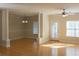 Bright living room featuring hardwood floors, elegant columns, and abundant natural light at 1310 Basildon Rd # 1310, Mount Pleasant, SC 29466