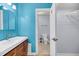 Modern bathroom boasts a sleek vanity with a wood finish and access to the closet at 1402 Camp Rd # 8B, Charleston, SC 29412