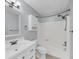 This is a bathroom with light blue walls, a sink with a mirror, a toilet, and a bathtub at 1402 Camp Rd # 8B, Charleston, SC 29412