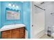 Modern bathroom boasts a sleek vanity with a wood finish and a shower-tub combo at 1402 Camp Rd # 8B, Charleston, SC 29412